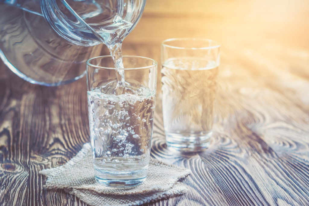 Glass Of Water On A Wooden Table - Blog